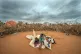 A Somali woman and child wait to be given a spot to settle a