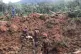 Rescuers work at a campsite following a landslide, in Batang