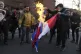 Iranian demonstrators set fire to French flags during their 