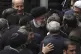 Iranian President Ebrahim Raisi (centre) is surrounded by a 