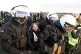 Police officers carry Swedish climate activist Greta Thunber