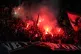 Al Ahly supporters light flares on the stands during the FIF