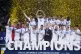 Real Madrid players celebrate with the trophy after winning 