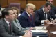 Former President Donald Trump sits at the defense table with
