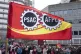 A flag flies as Public Service Alliance of Canada members wa