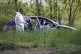 Forensic police operate on a car in the village of Dubona, s