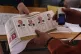 An official holds ballots at a polling station, in Istanbul,