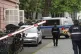 Judiciary vans, each carrying defendants, drive in a courtya