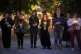 Women hold candles during a silent protest to commemorate a 