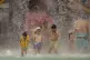 People escape the searing summer heat at Baghdad Aquatic Cen