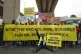 Protesters pose as they demand action on climate change, dur