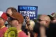  A member holds up a sign at a rally by United Auto Workers 
