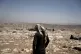 Palestinian shepherd Mustafa Arara, 24, stands in the ruins 