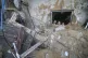 Palestinian children look at the building of the Zanon famil