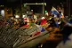 Demonstrators tear down a police barricade during a protest 