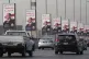 Vehicles pass near banners supporting Egyptian President Abd