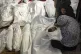 Palestinians mourn their relatives killed in the Israeli bom