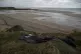 A damaged inflatable boat is pictured on the shore in Wimere