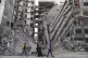 Palestinians walk through destruction in Gaza City, November