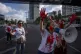 Mothers of Israeli soldiers who serve in Gaza hold up their 