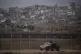 Israeli soldiers move near the Israeli-Gaza border, as seen 