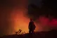 A firefighter from the city of Monterey monitors flareups fr
