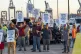 Longshoremen carry signs and chant Tuesday, Oct. 1, 2024, ou