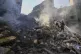 Rescue workers search for victims at the site of Thursday's 