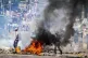 A barricade burns in Mozambique's capital, in protests that 