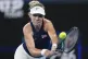 Britain's Katie Boulter plays a backhand return during her q