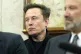 Elon Musk listens as President Donald Trump meets with India