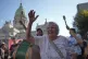 A retiree rallies calling for higher pensions and against au