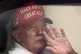 Us President Donald Trump waves to supporters from his limou