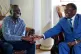 Zimbabwean President Emmerson Mnangagwa (right) talks to opp