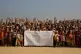 Rohingya refugee children raise their hands and shout that t