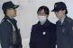 Choi Soon Sil (centre) arrives at the Seoul Central District