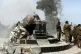 Turkey-backed fighters celebrate around a statue of Kawa, a 