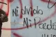 Graffiti covers a wall that reads in Spanish: 