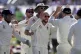 Jack Leach (centre) celebrates with his England teammates af