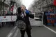 A man wears a mask of French President Emmanuel Macron durin