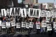 People hold signs resembling those carried by striking sanit