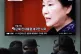 People watch a South Korean news item on former president Pa