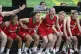 England teammates celebrate their victory over Canada in the