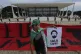 A young man holds an image of Brazil's former President Luiz
