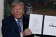 President Donald Trump shows a signed Presidential Memorandu