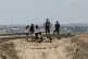 Israelis look at Gaza Strip from an observation post at the 