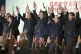 Japan's Prime Minister Shinzo Abe (centre) shouts traditiona