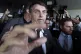Brazil's President-elect Jair Bolsonaro is surrounded by the