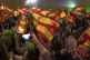 Supporters of Spain's far-right Vox party, wave Spanish flag