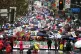 Thousands of teachers and supporters march in the rain durin